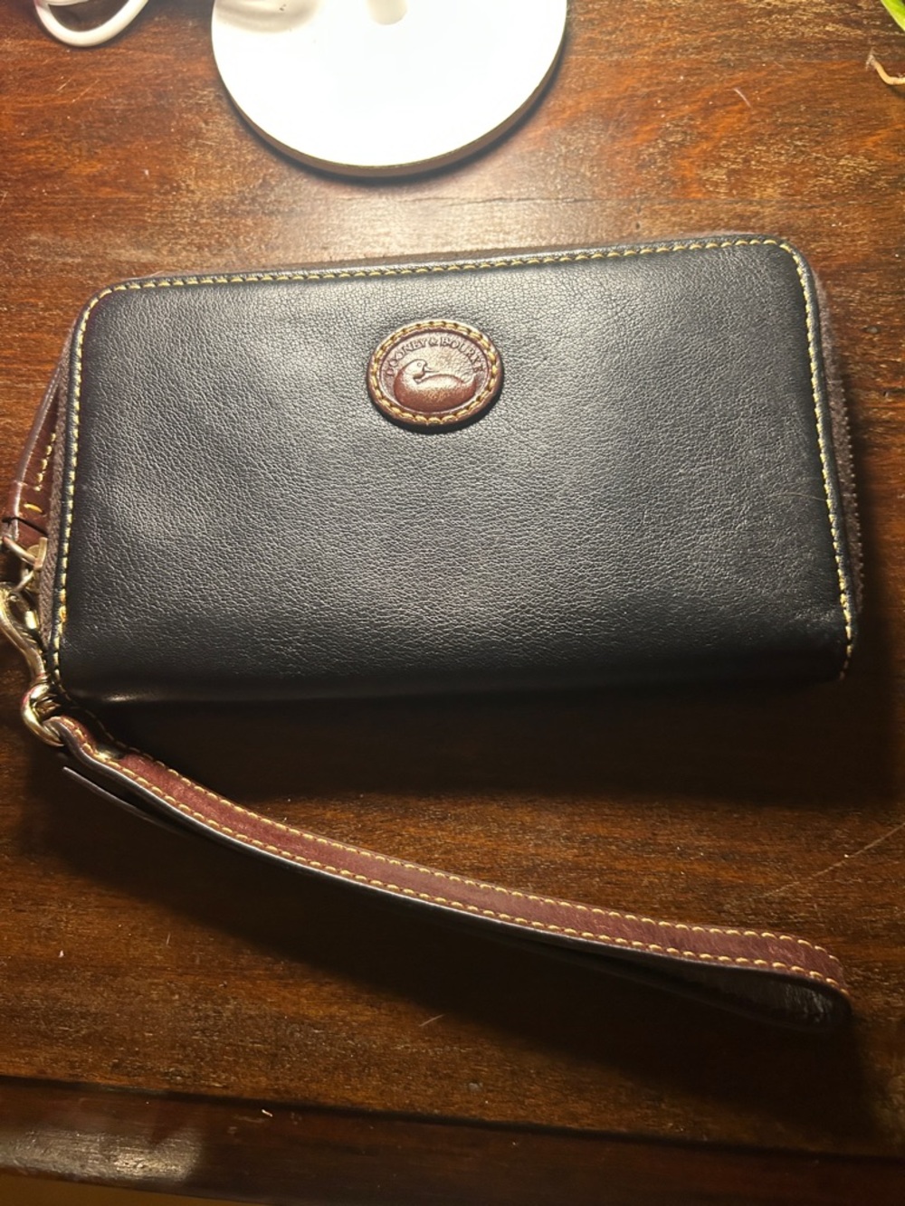 Dooney & Bourke Black Leather Zip Wallet with Brown Accents and Wrist Strap